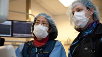 Doctors looking at computer screen